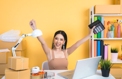 An image includes an Amazon Seller with a pc on a table with some product boxes