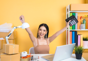  An image includes an Amazon Seller with a pc on a table with some product boxes