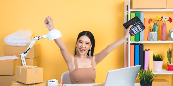 An image includes an Amazon Seller with a pc on a table with some product boxes